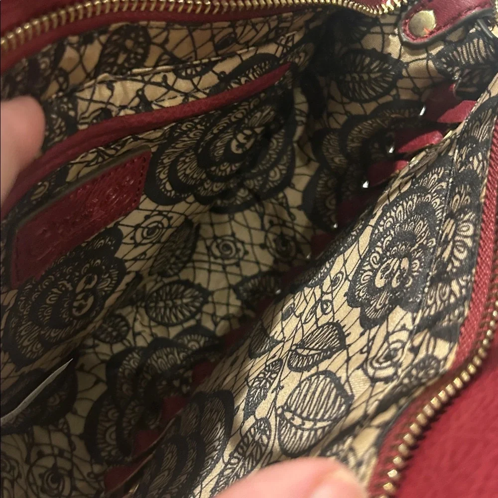 Carlos Santana faux pebbled leather maroon western crossbody bag laser cut rings